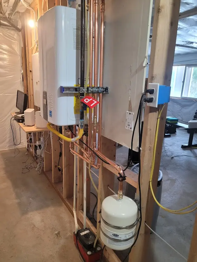 Licensed plumber repairing a kitchen sink in Monessen